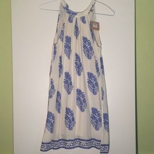 White dress with blue floral pattern